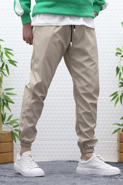 Erkek Jagger Pantolon Paraşüt Kumaş Su Tutmaz Rüzgar Geçirmez Paça Lastikli - Bej